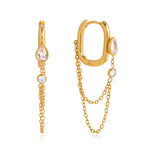isolated gold plated hoop earrings with clear stone chain accents