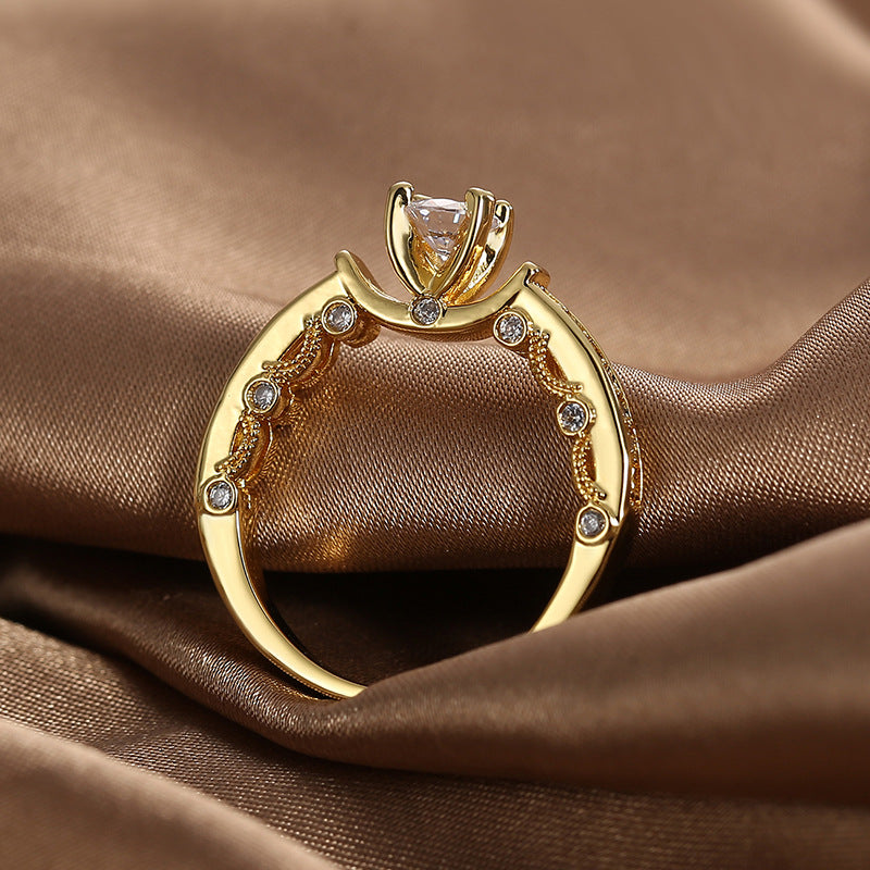 rear view of the four-prong clear stone setting and split shoulders