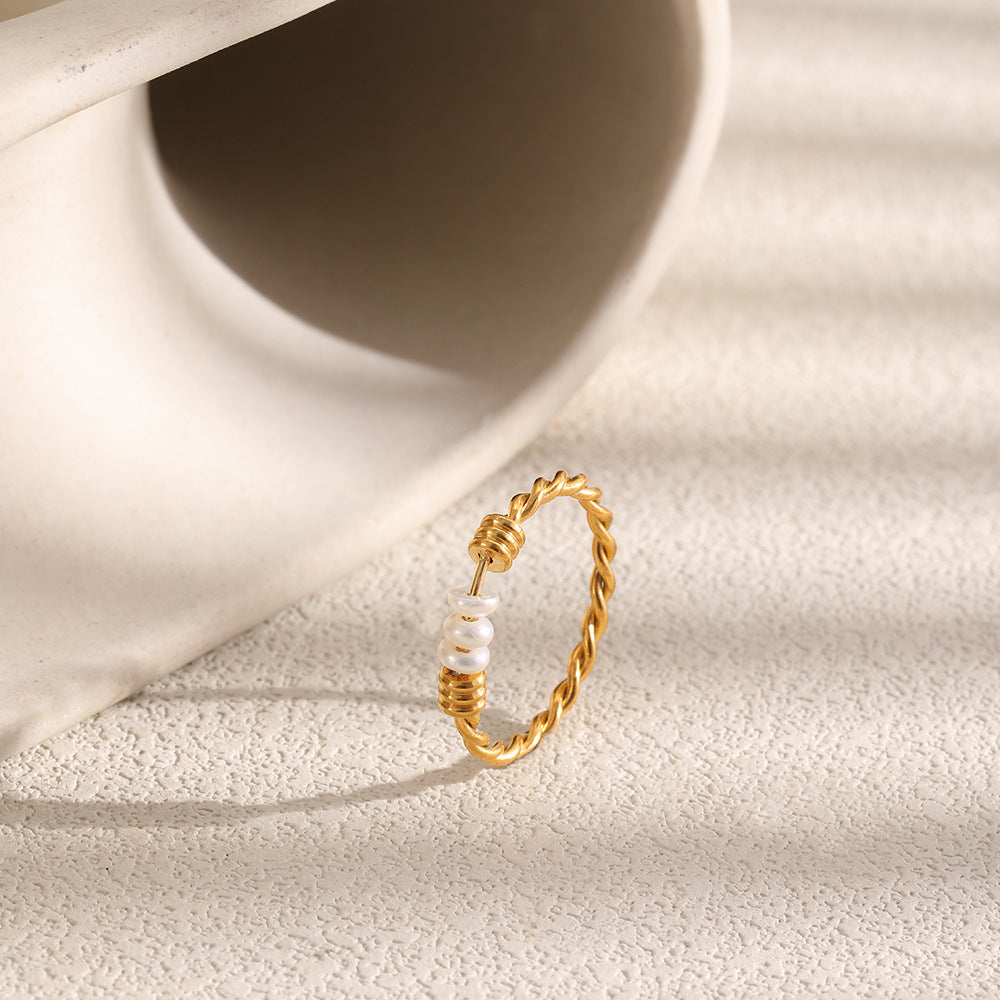 Slender twisted band standing on a pale surface