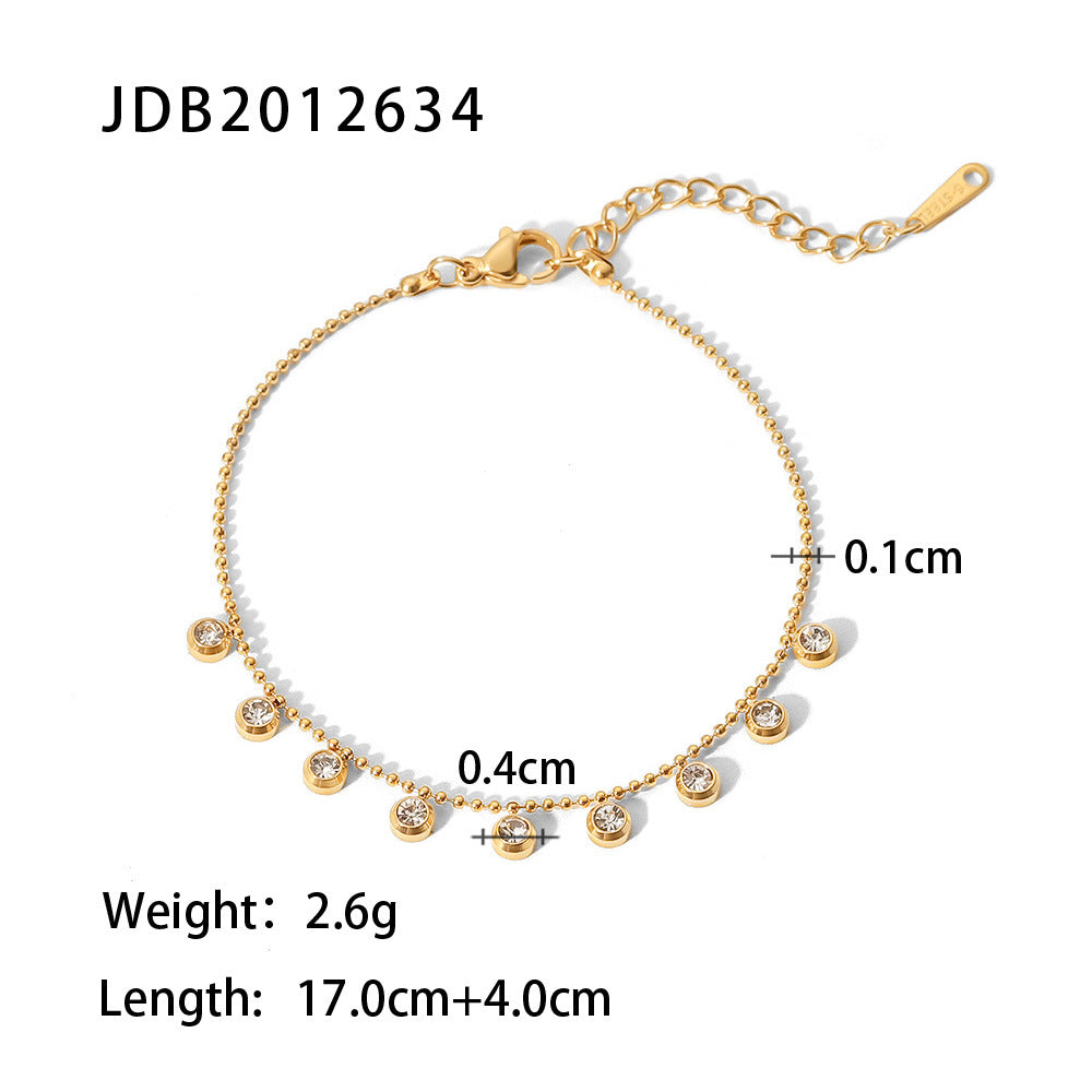 Fine chain bracelet with dangling clear round accents