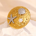 gold plated ocean motif statement ring with pearl and silver accents
