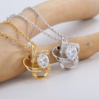 side view of looping orbit frames around round clear center stones