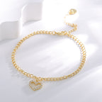 cubic zirconia heart charm anklet displayed on white blocks