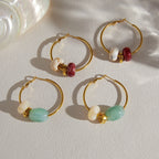 Two bead colorways on a pale fabric surface