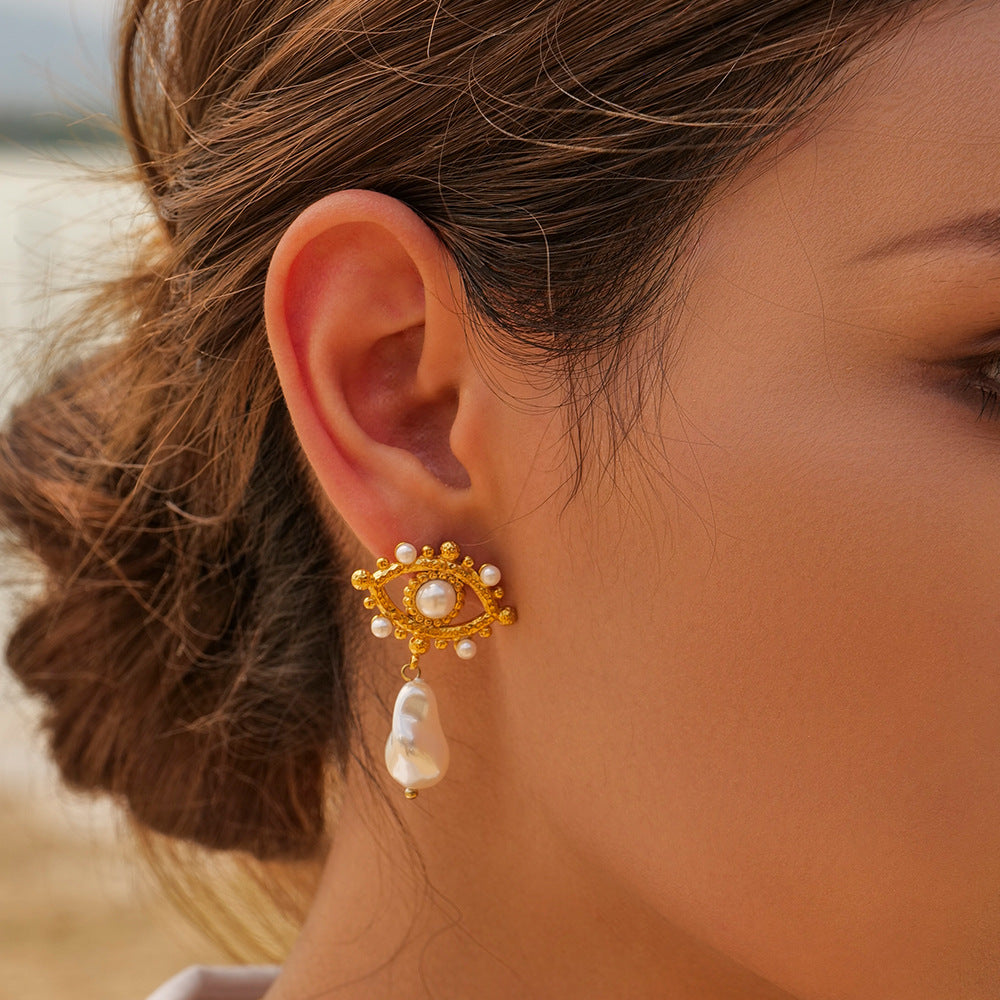 Gold-tone flower white bead stainless steel drop earrings worn view