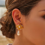 Gold-tone flower white bead stainless steel drop earrings worn view