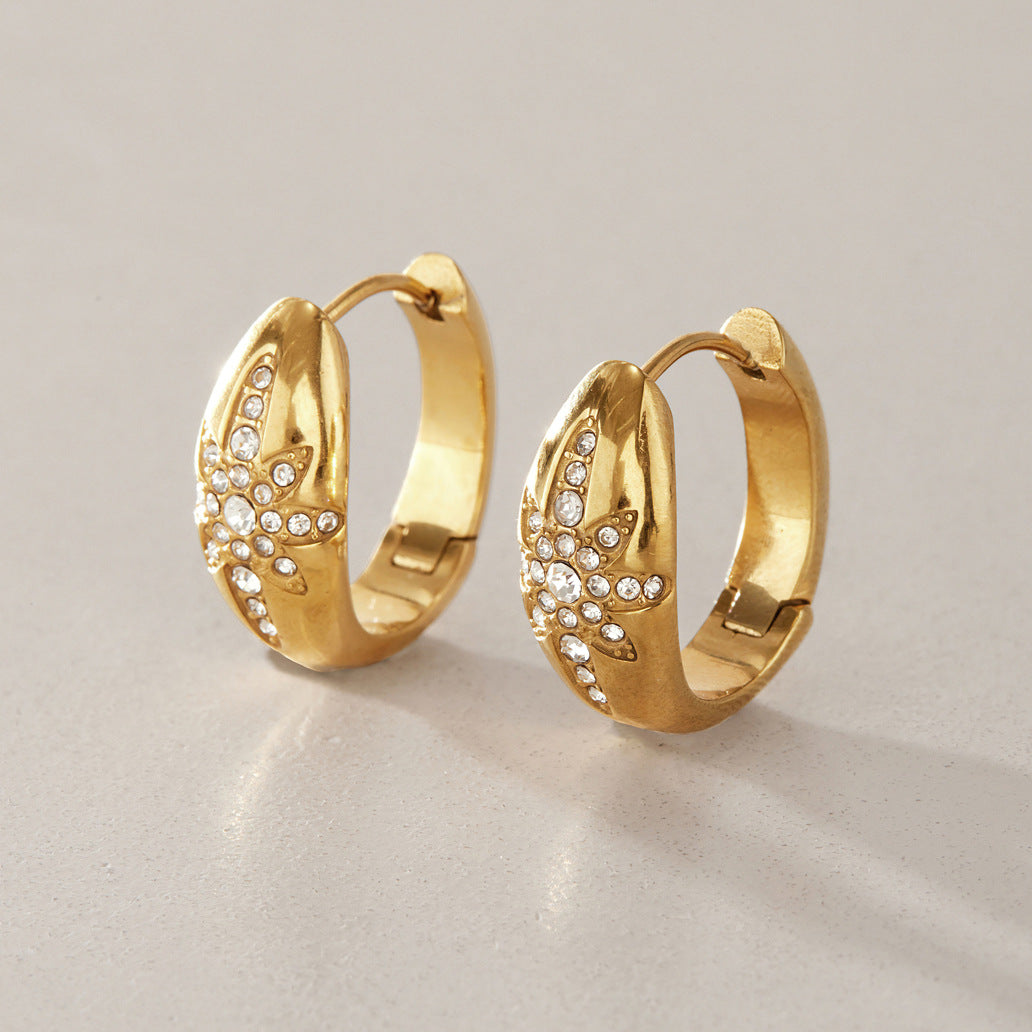 Front and rear view of hinged starburst hoop earrings