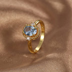 side view of beaded oval frame and slim gold plated ring band