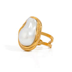 Isolated elongated white inlay ring in a gold frame