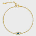 gold plated blue evil eye station bracelet on white