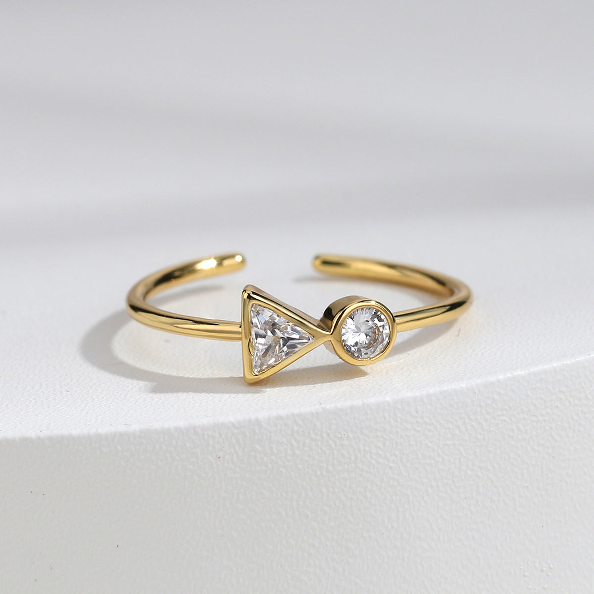 gold plated brass open ring with triangle and round clear zirconia
