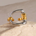 Front view of the silver-tone square and gold-tone supports