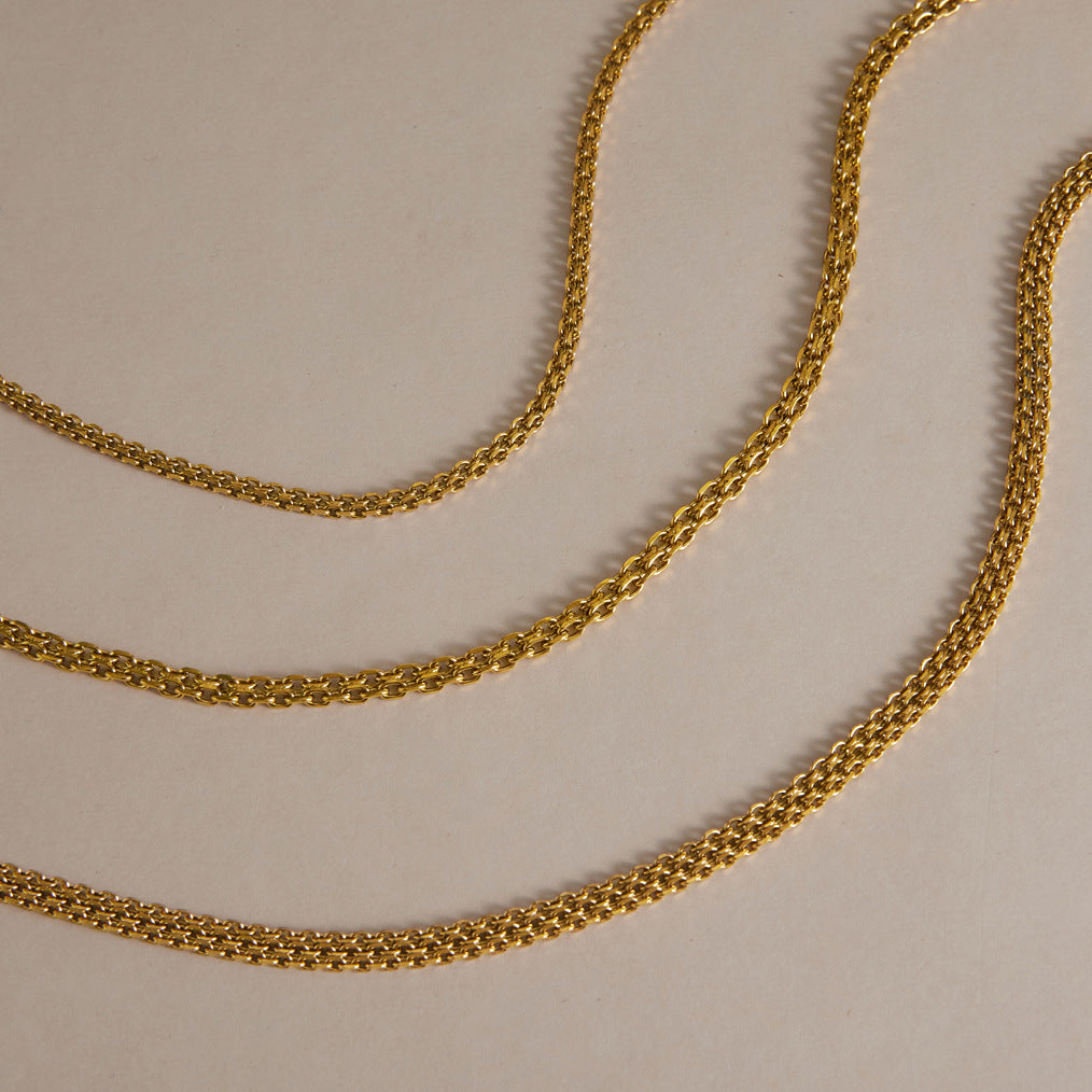 Three gold tone chain necklaces with different link profiles