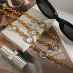 Two-tone CZ paperclip chain necklace styled with matching bracelet