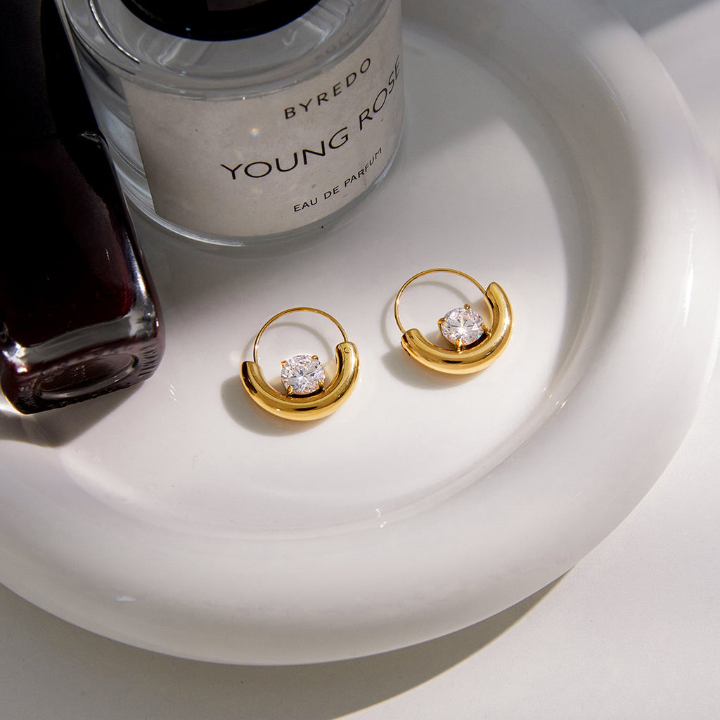 pair of gold plated half-moon clear-stone hoop earrings