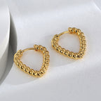 gold plated rope-textured heart hoops shown from an angle