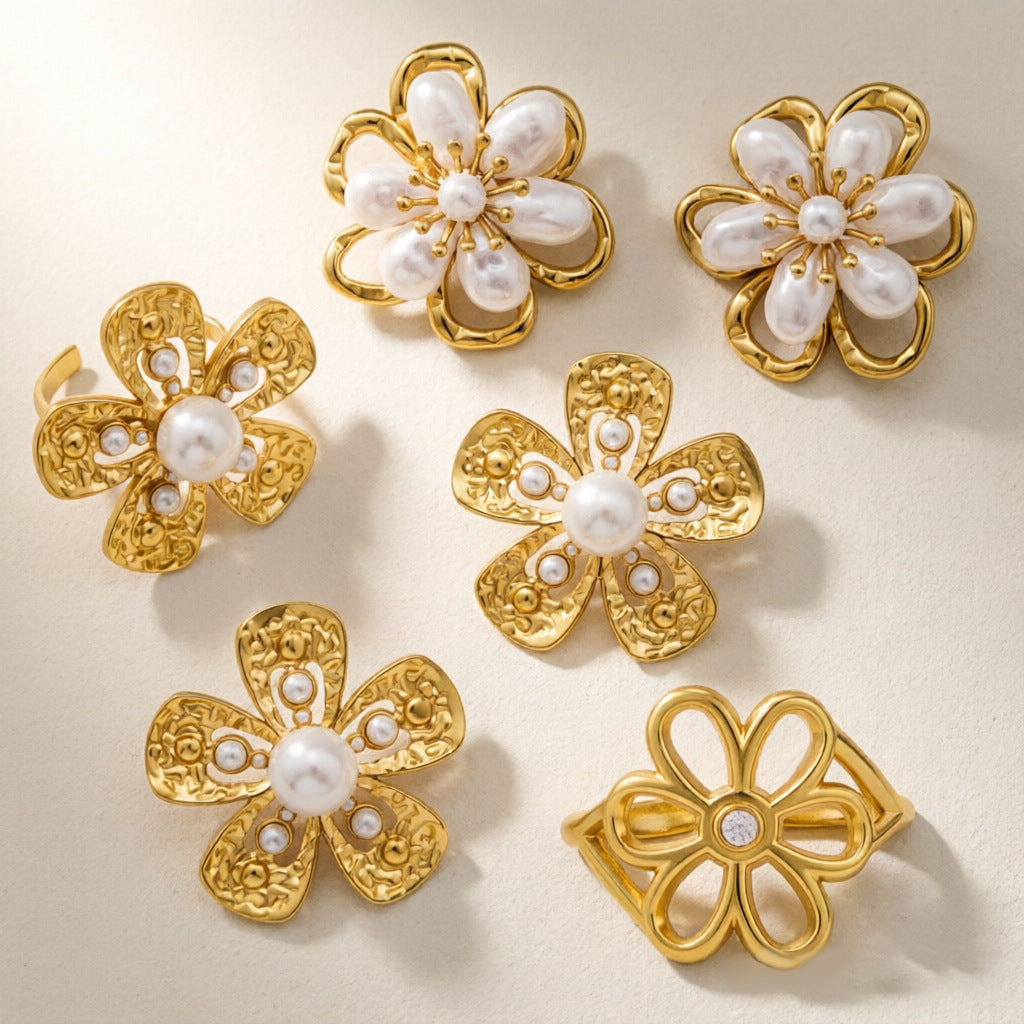 Four flower earring and ring designs displayed together