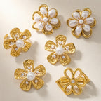 Four flower earring and ring designs displayed together