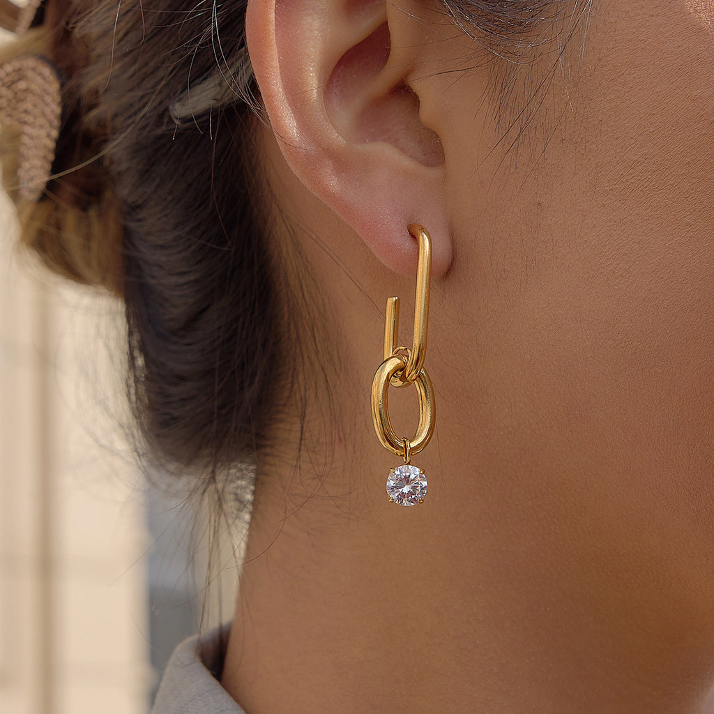 gold plated geometric link clear-stone drop earring worn on ear
