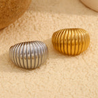 front view of gold and silver chunky ribbed dome rings