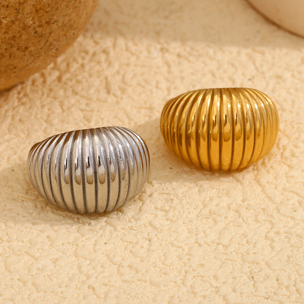 front view of gold and silver chunky ribbed dome rings