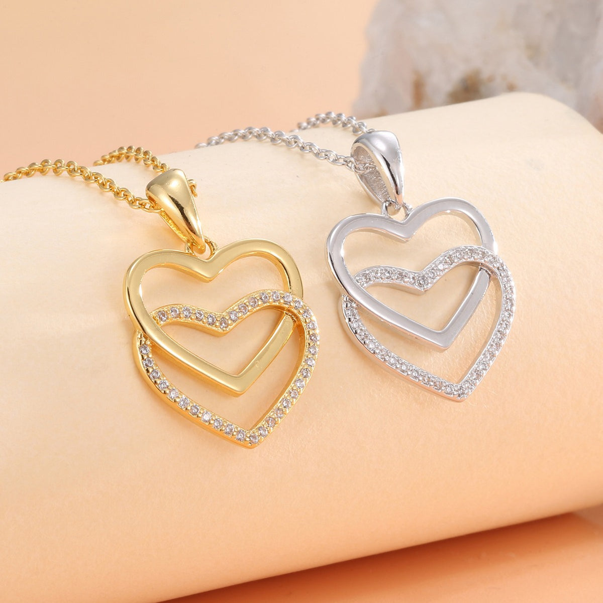 double heart clear stone pendants in gold plated and silver finishes