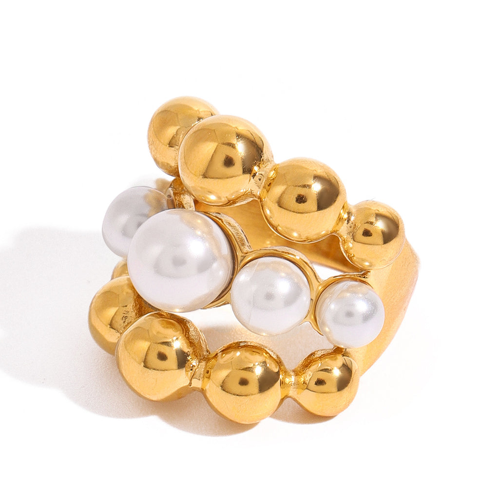 Close view of the pearl-look triple-row stainless steel ring