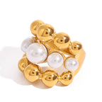 Close view of the pearl-look triple-row stainless steel ring