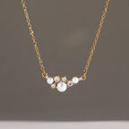 White bead and clear-accent cluster necklace