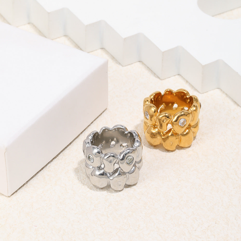 paired sculptural pebble rings with layered rounded forms