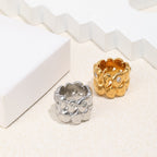 paired sculptural pebble rings with layered rounded forms