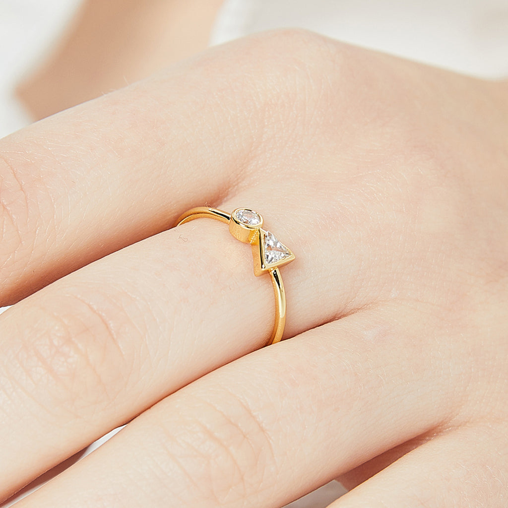 triangle and round zirconia ring worn on the finger