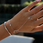 Silver tone snake bracelet styled with separate hand jewelry