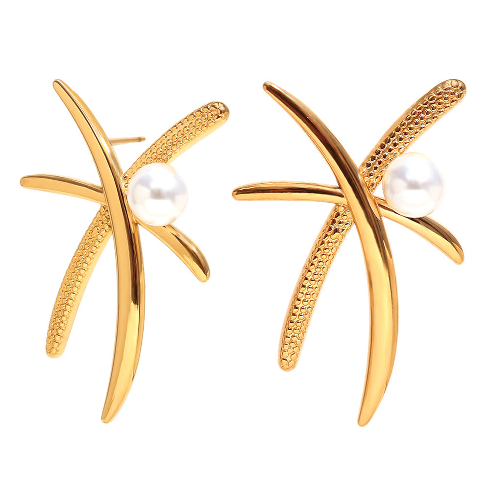 isolated pair of textured palm frond pearl stud earrings