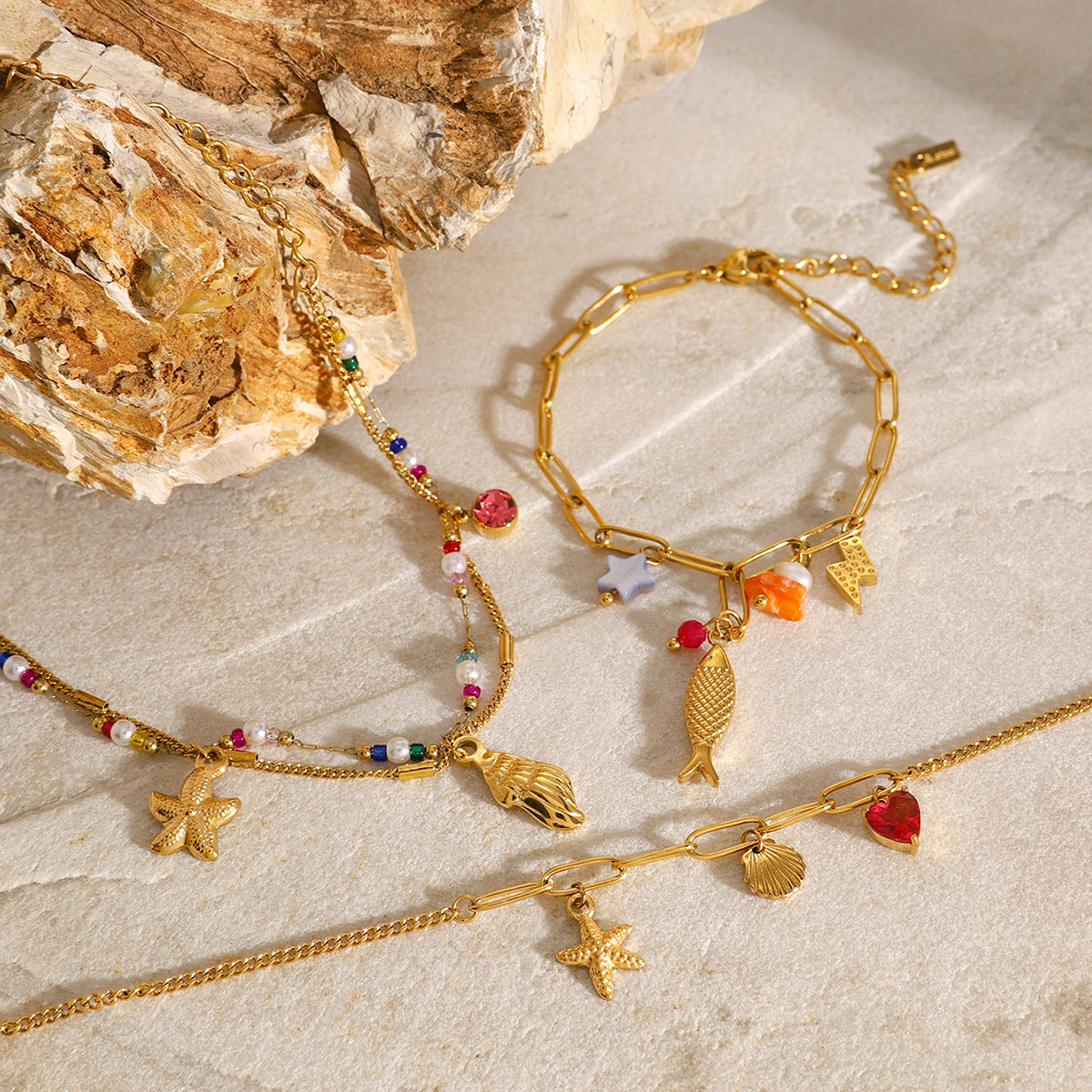 Gold Plated Stainless Steel Ocean Charm Bracelet Collection — detail view