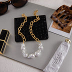 Mixed-texture necklace displayed with a matching bracelet