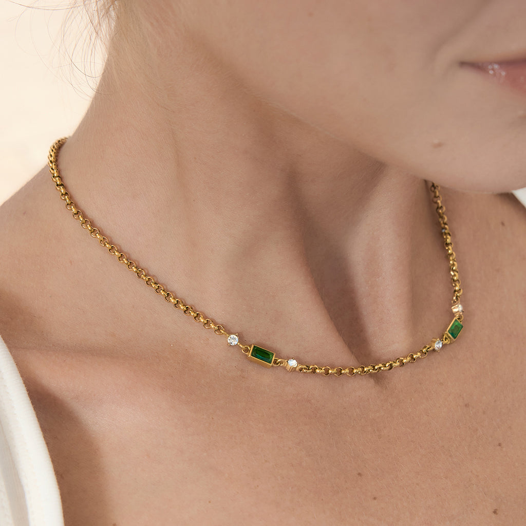 Rectangular green stone necklace worn close-up