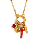 Cowrie shell and seahorse pendant necklace on a white background