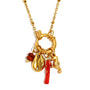 Close view of the red accents and front ring on the marine necklace