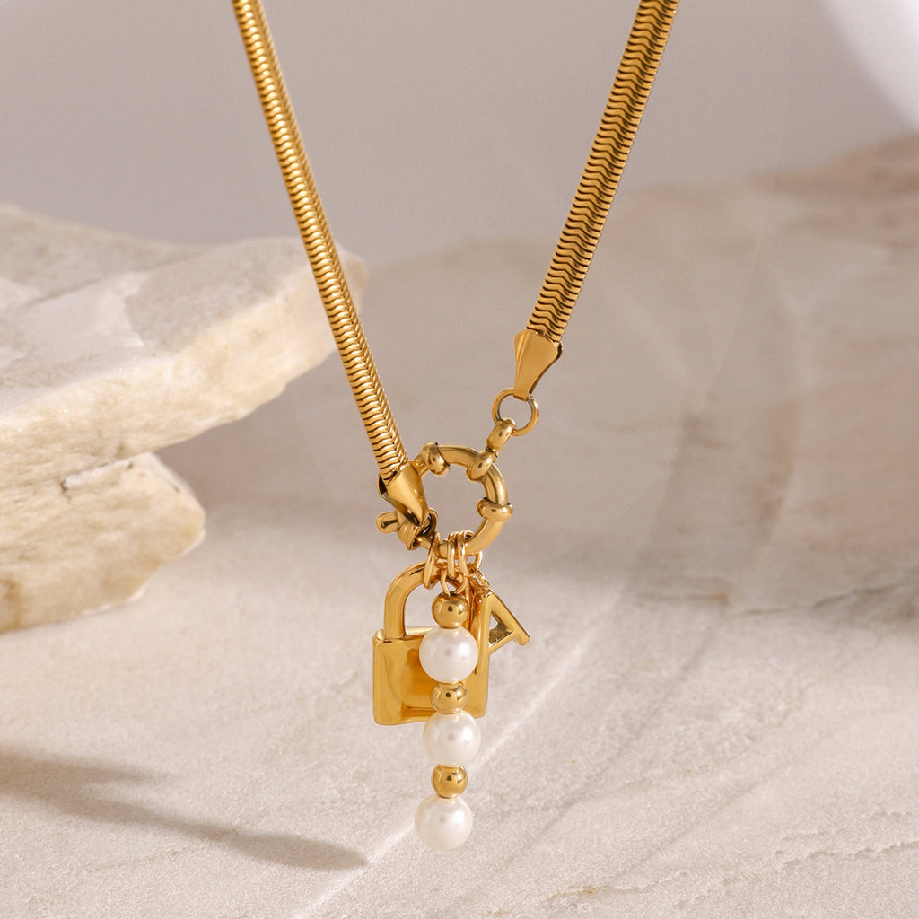 Gold-Tone Stainless Steel Lock Charm Necklace with Pearl-Look Drop — styled view