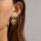 Two-Tone Double-Heart Stainless Steel Stud-Drop Earrings shown on model