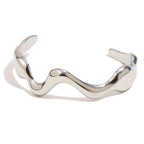 silver-finish irregular wave cuff with broad rounded ends