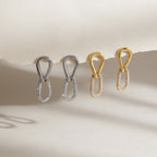 Gold and silver tone stone-accented link earrings displayed together