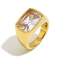 isolated gold plated rectangular clear stone cocktail ring