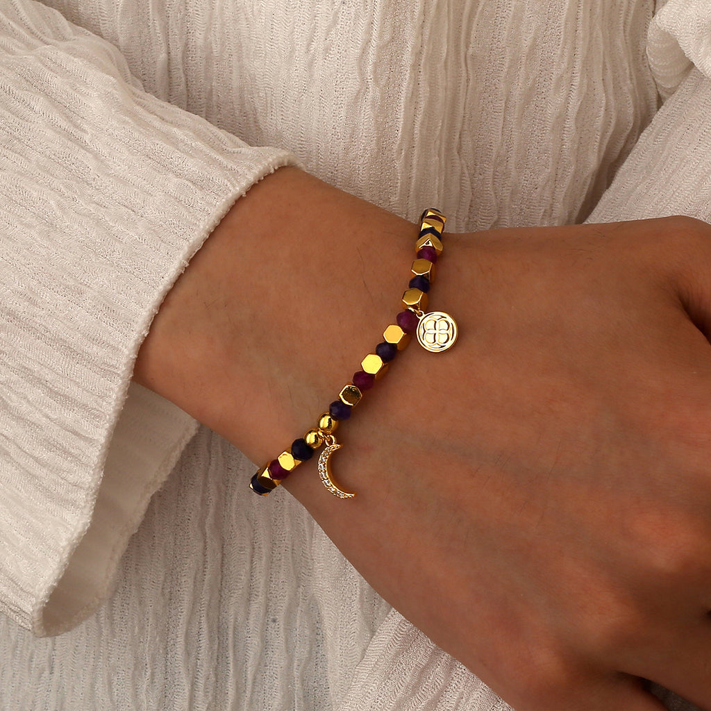 model wearing the gold plated purple and magenta moon bracelet