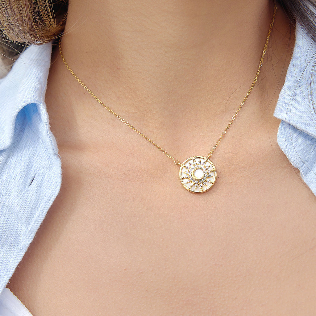 Pale sun pendant necklace worn alone