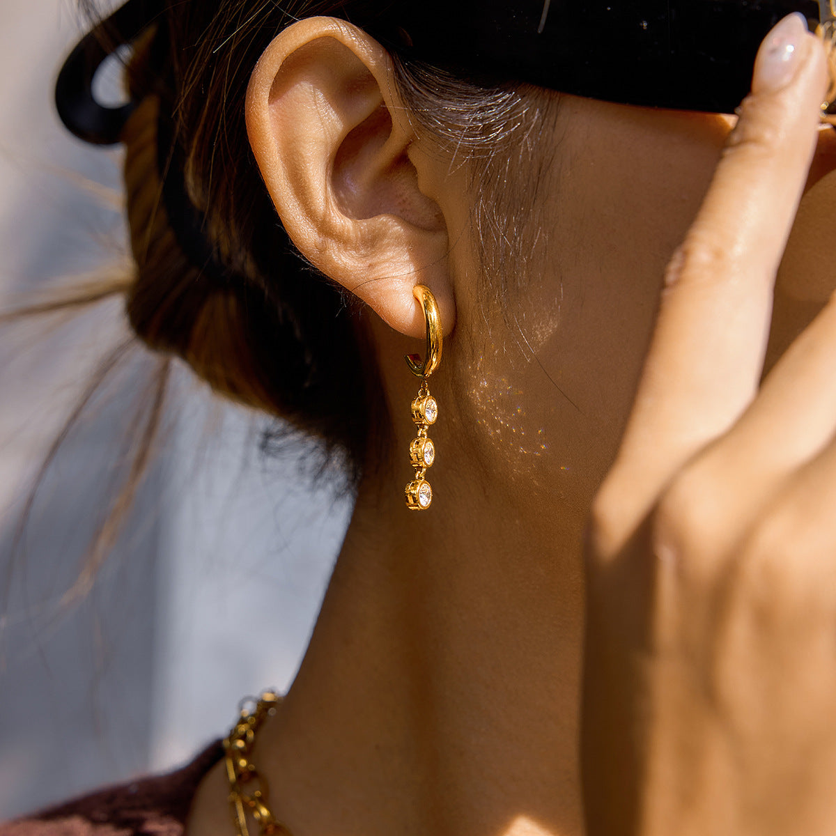 side profile of the compact triple-stone hoop earring