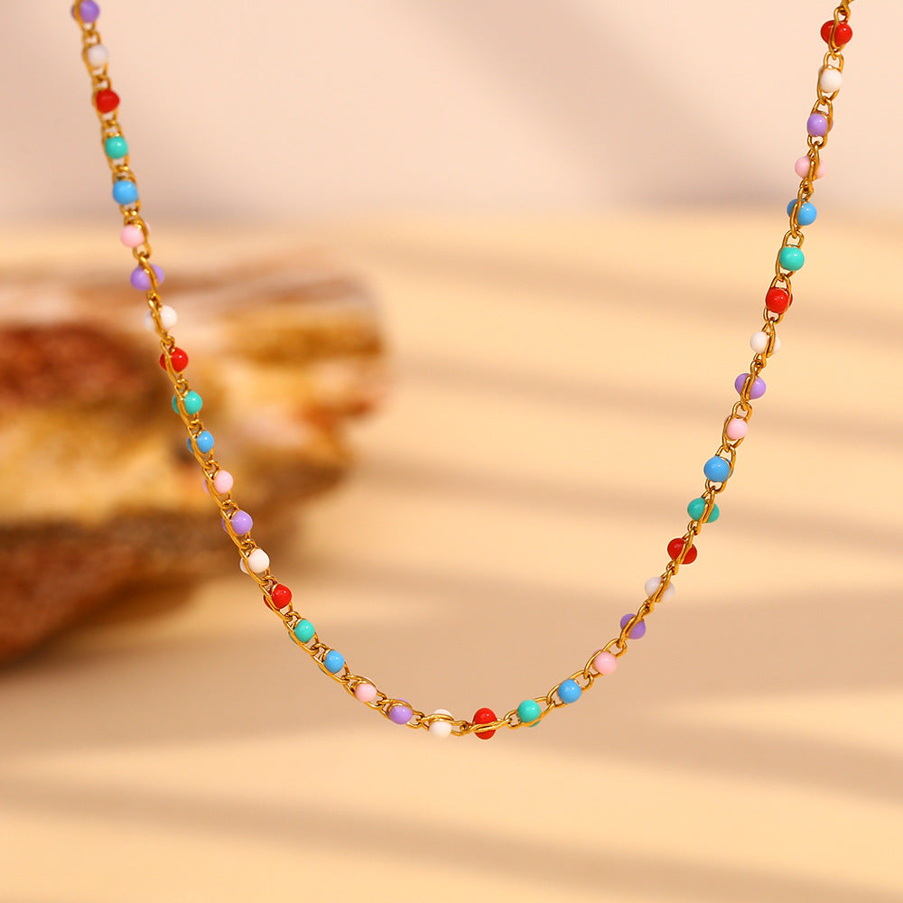 Multicolor bead station necklace with a gold plated stainless steel chain