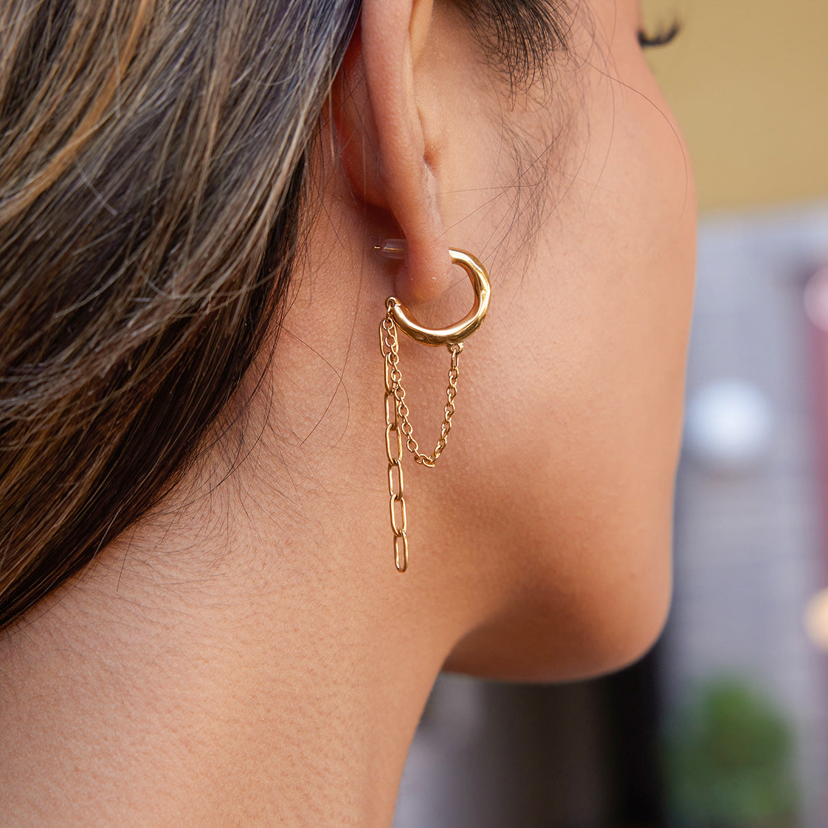 side view of the asymmetric gold plated chain-drop hoop earring