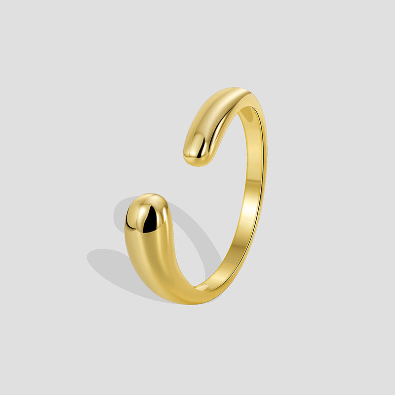 gold plated brass asymmetric teardrop open ring on gray
